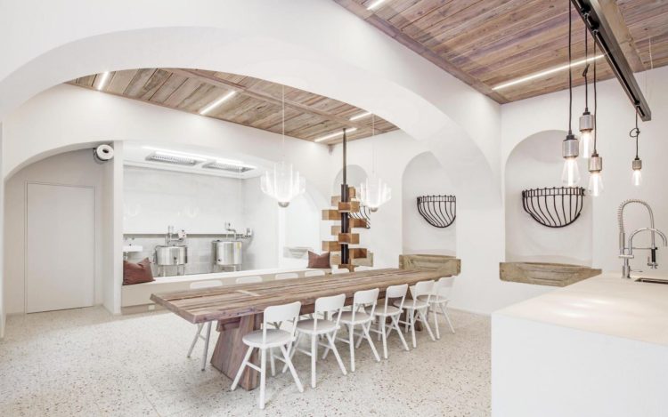 white walls, wood ceiling and table in restaurant