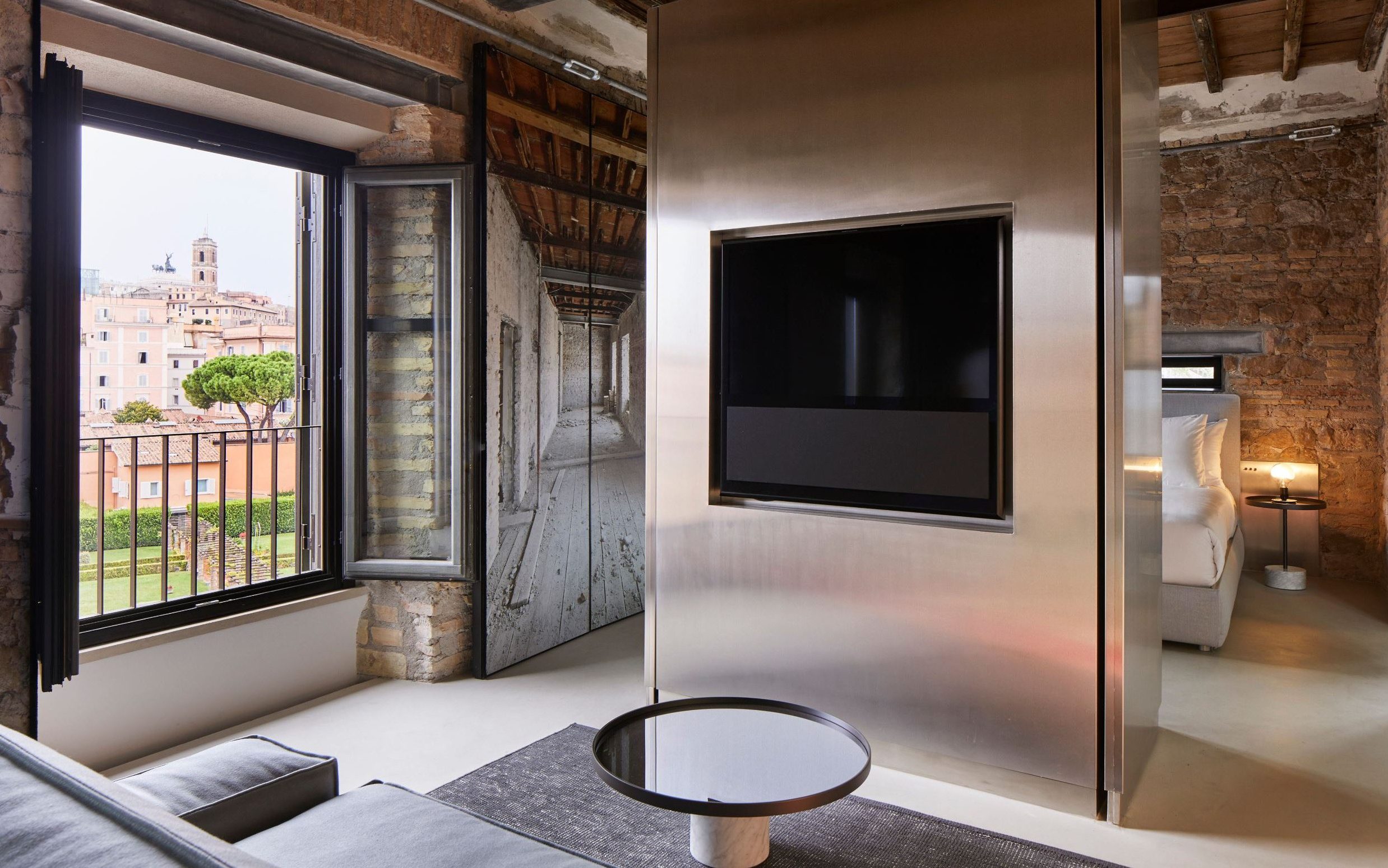 hotel room with brick and metal finishes